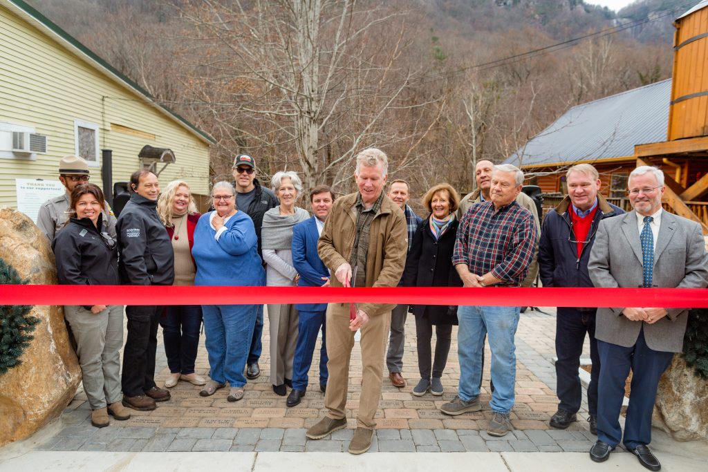 Mayor Peter O'Leary cuts the ribbon for Chimney Rock Village phase 1